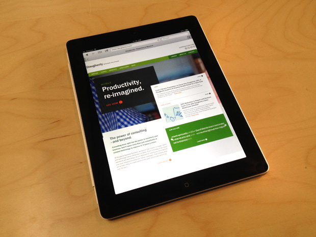 The website design for Daugherty Business Solutions on an iPad