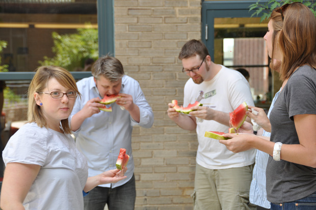 Atomicdust staffers devour a defenseless watermelon