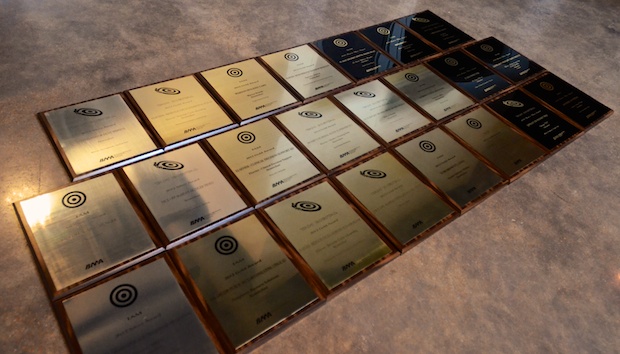 Rows of 24 TAM Awards won by Atomicdust for branding and marketing