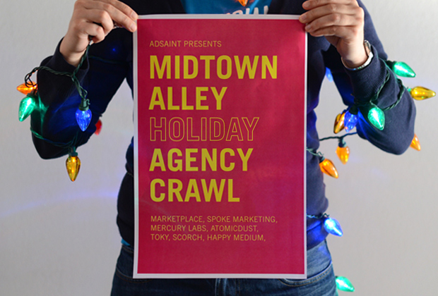 Atomicdust designer holding a Midtown Alley Agency Crawl Poster