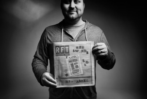 Mike Spakowski hold a copy of the RFT newspaper awards issue.