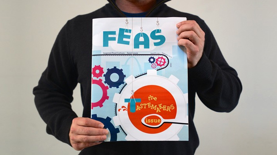 Atomicdust designer holds an issue of Feast Magazine
