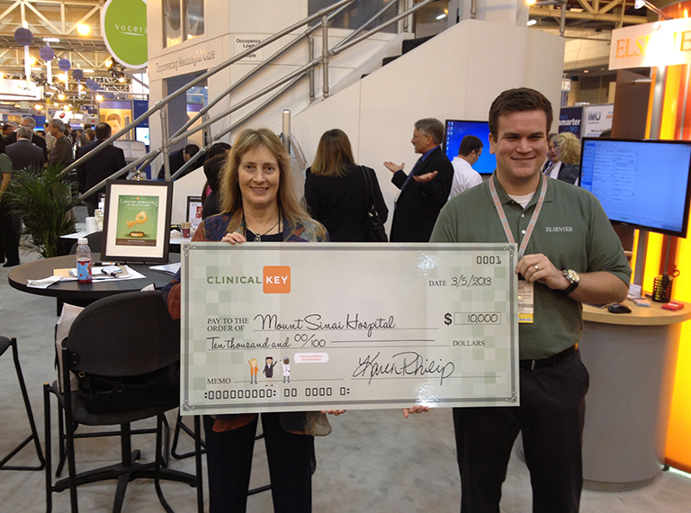 Presenting the Clinical Key- Key Innovators winners with an oversized check
