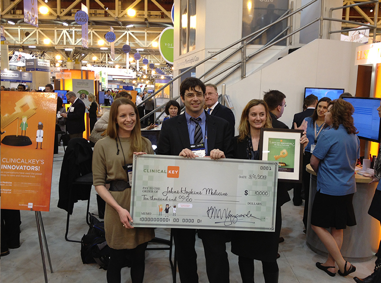 Presenting the Clinical Key- Key Innovators winners with an oversized check