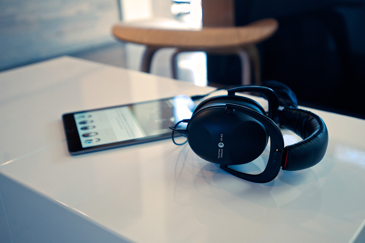 DirectSound headphones lay on table with iPad