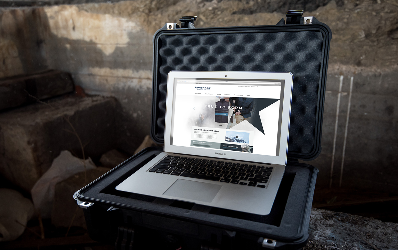 A laptop inside of a gun case with the Propper Website design