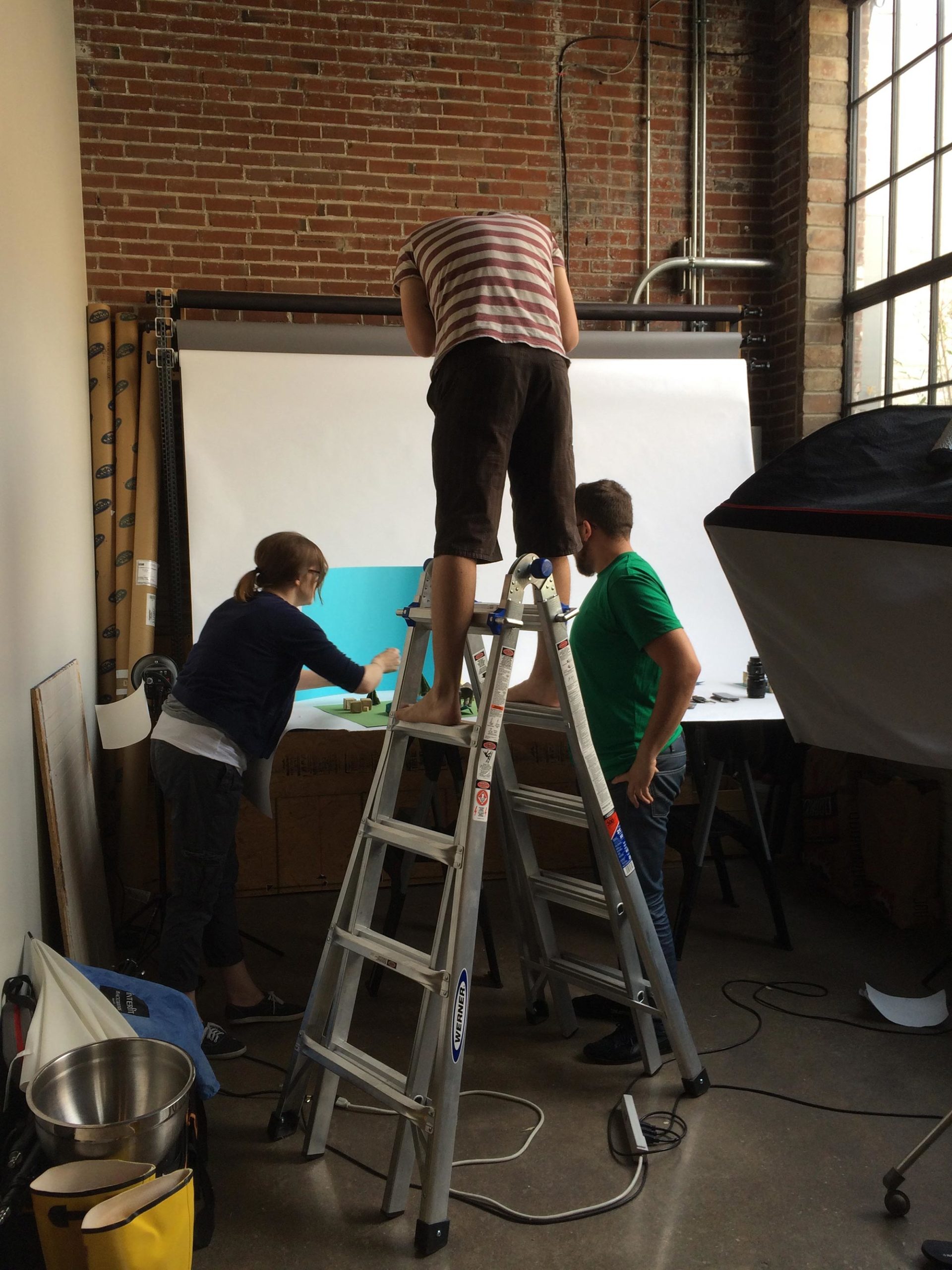 Atomicdust team photographing the Annual Report for the St. Louis Zoo