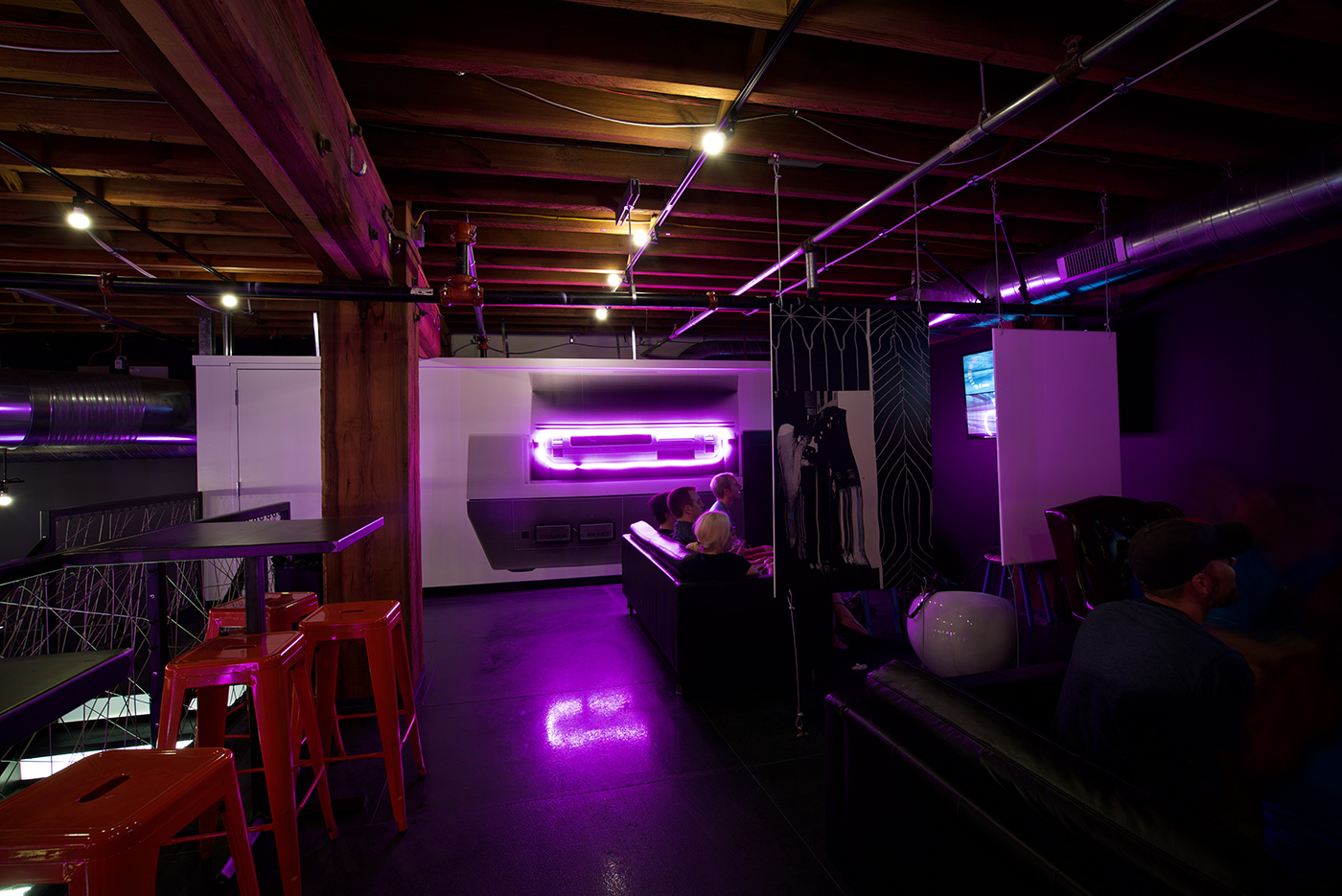 The neon lit Nintendo wall at Start Bar in St. Louis