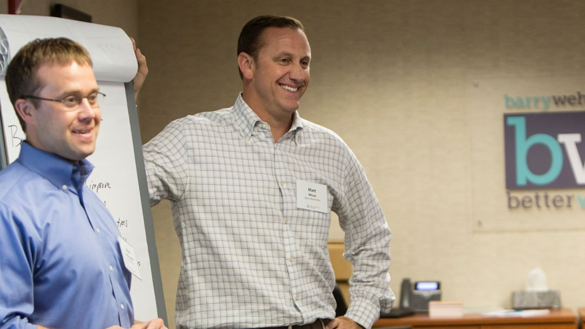 The smiling team of Berry Wehmiller Leadership Institute at the branding workshop