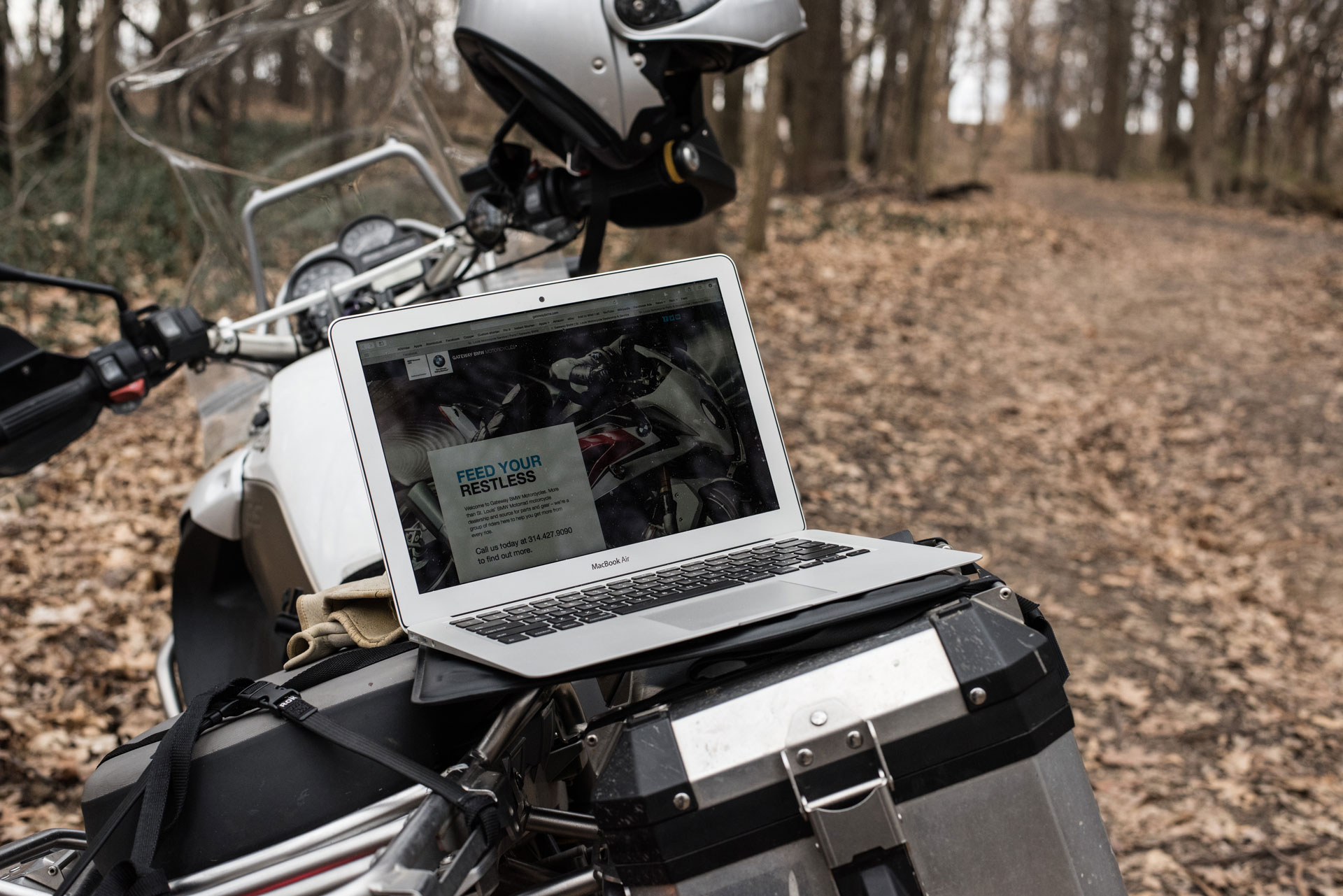Laptop on a motorcycle displaying the Gateway BMW website