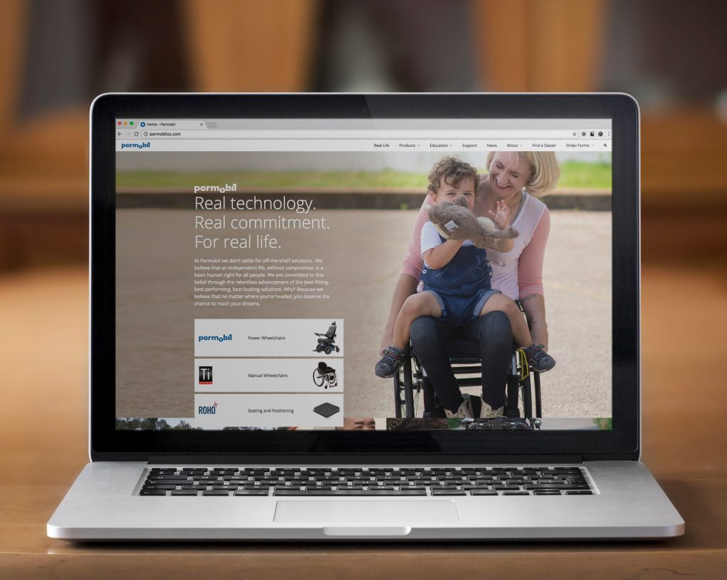 Permobil's new website design on a laptop