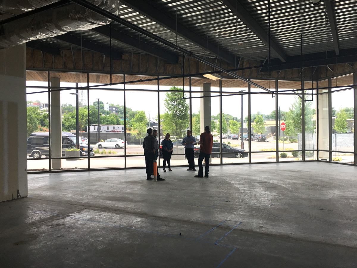 The Atomicdust creative team walks around the Pastaria Nashville construction