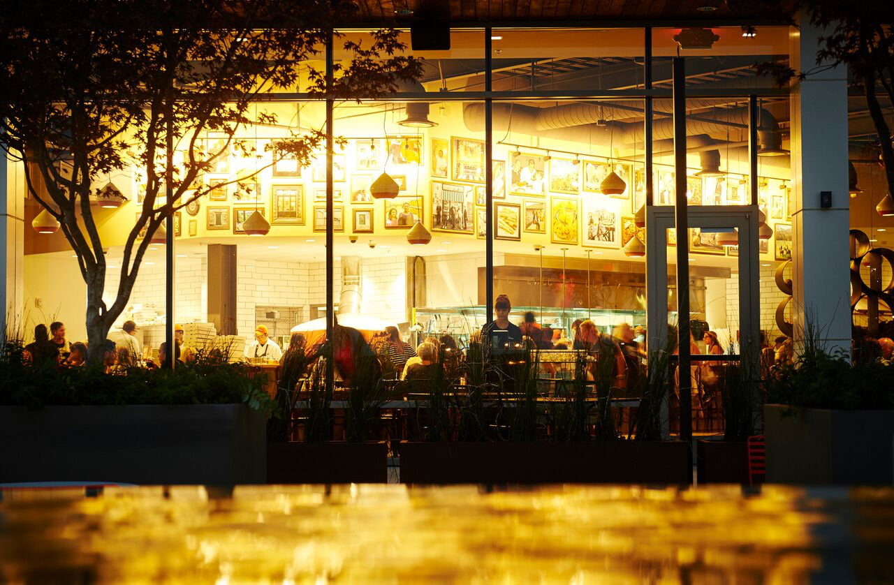 The glow of the lights outside of the Pastaria Nashville