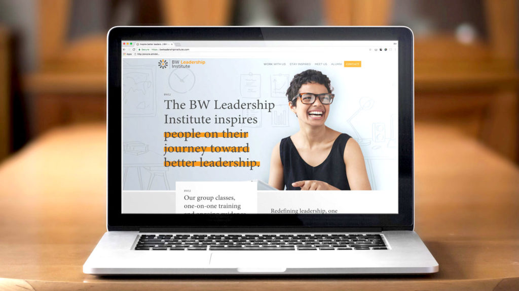 Barry-Wehmiller Leadership Institute - Website Design on a laptop
