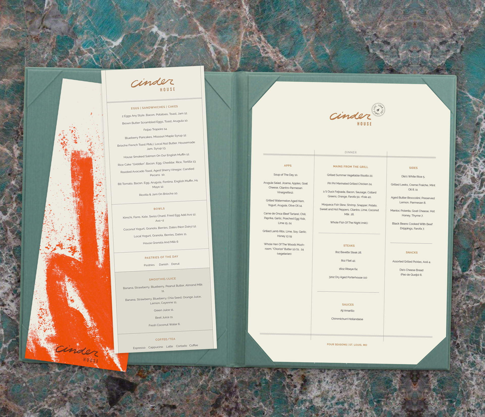 The menu design for Cinder House in a leather binder