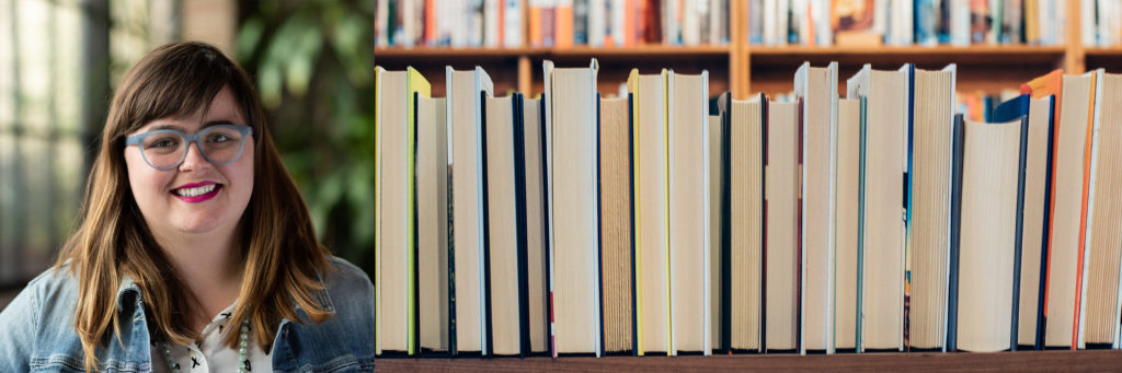 Atomicdust Digital Marketing Manager Blaise Hart-Schmidt and a shelf of books