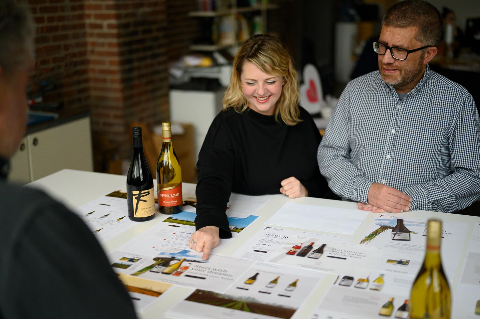 Erika and Rich look at mockups of the Ron Rubin Winery website design