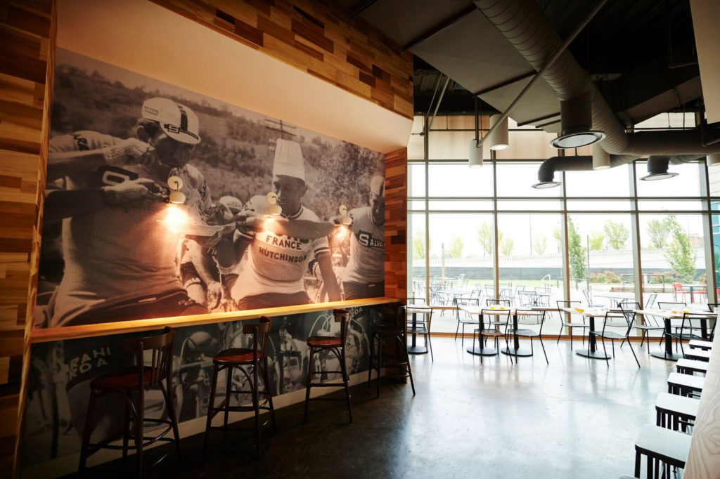 A mural inside Pastaria Nashville shows a cyclist eating pasta