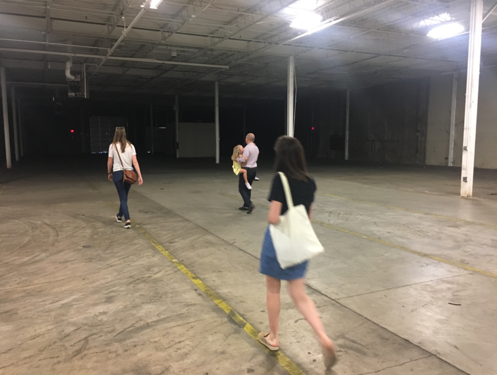 The Atomicdust team tours the warehouse