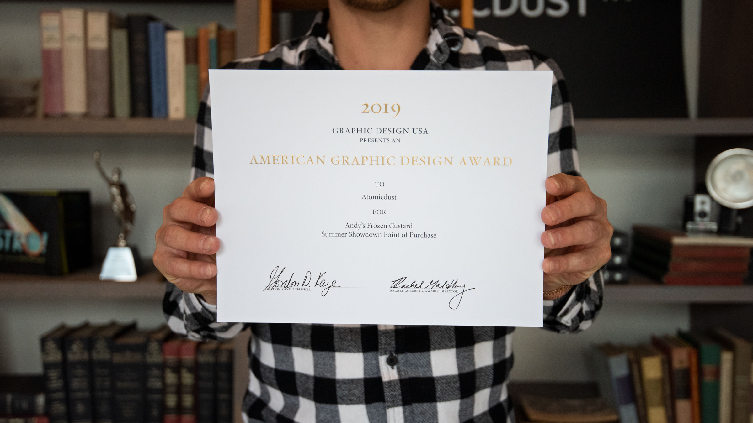 Atomicdust team member holds GDUSA American Graphic Design certificate