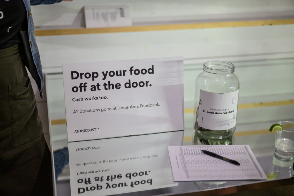 A sign and donation jar for St. Louis Area Foodbank