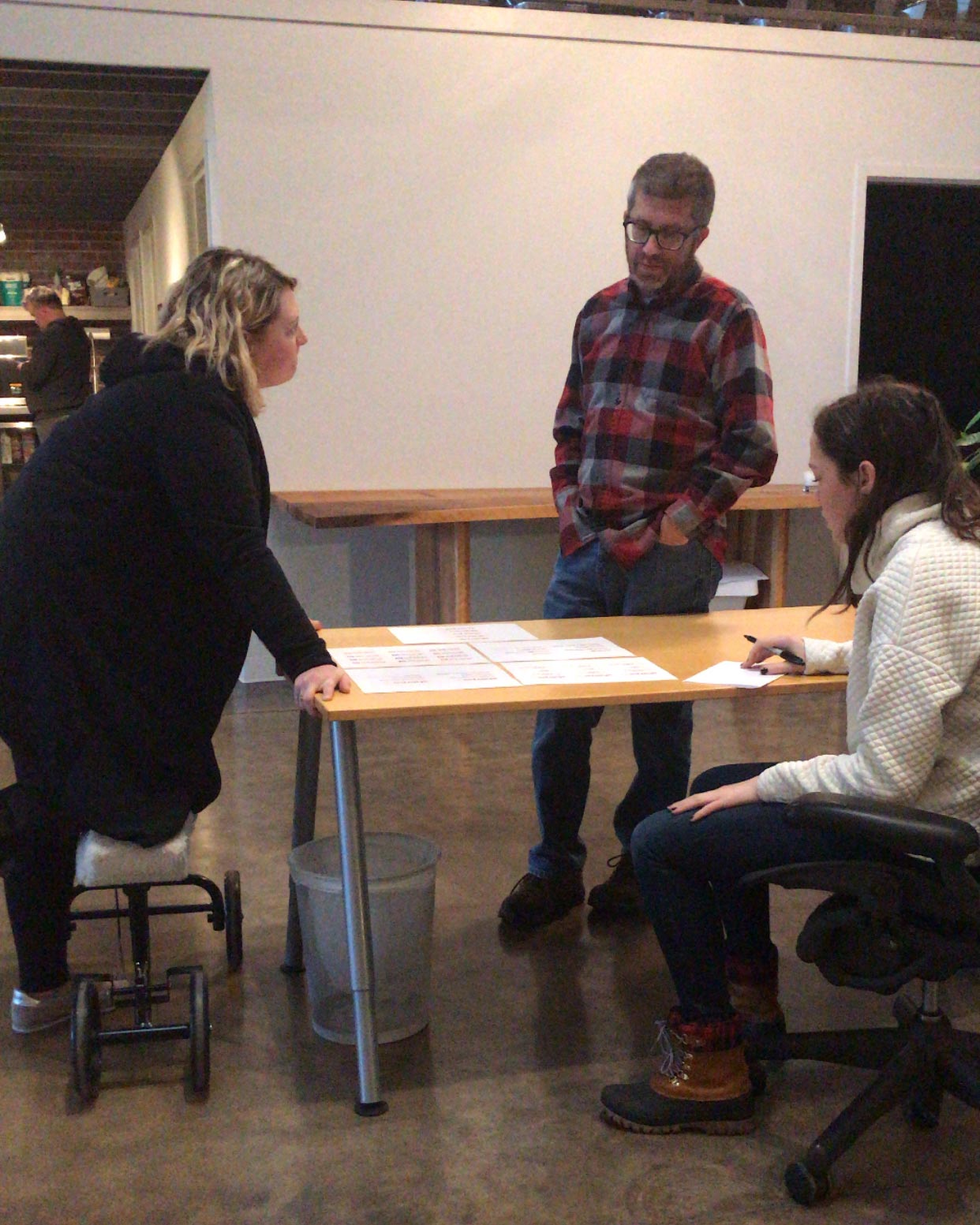 The Atomicdust creative gathers to discuss a website design project