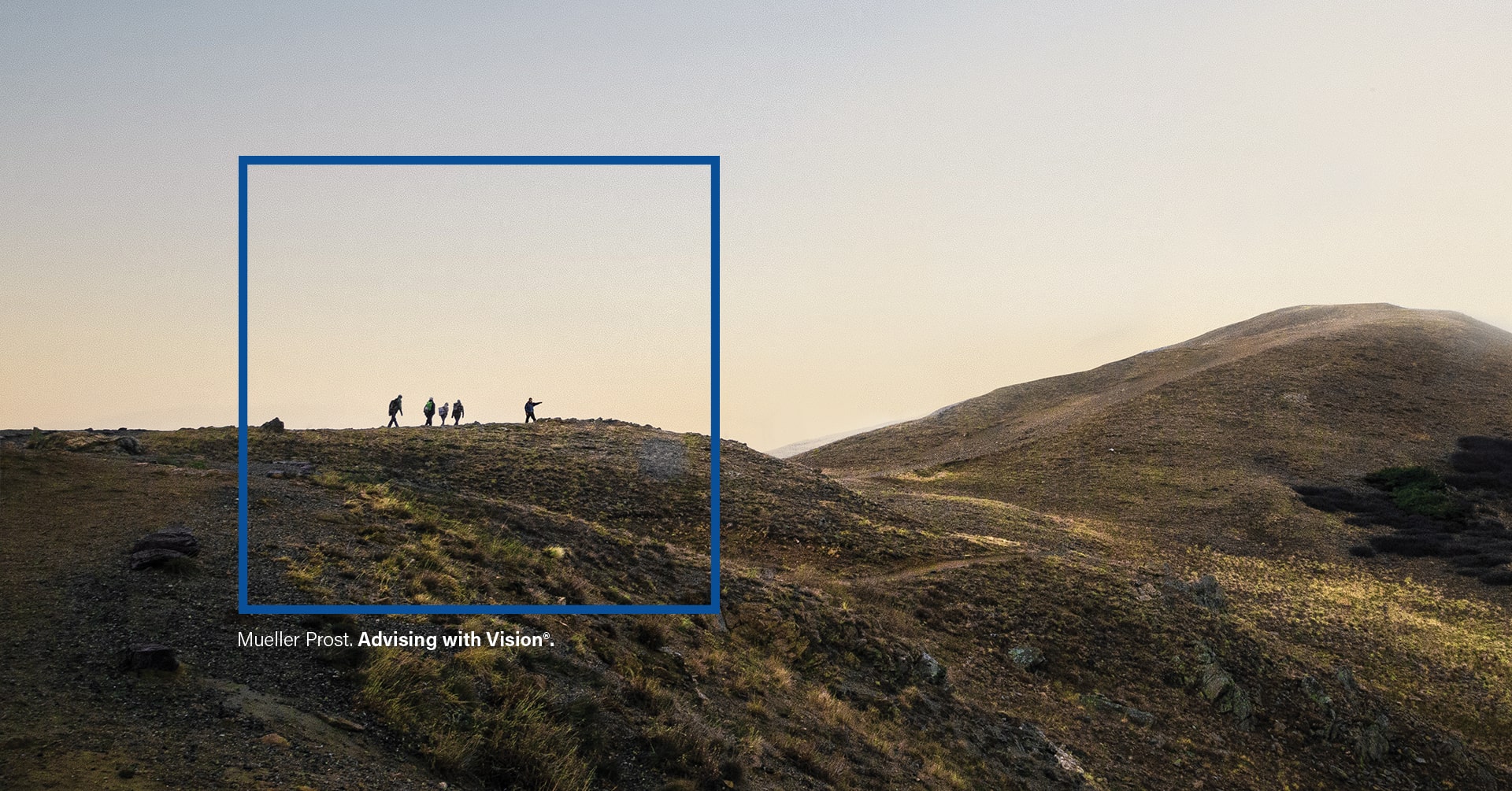 Graphic from the Mueller Prost website design shows a square over a photo of hikers with the words Advising with Vision