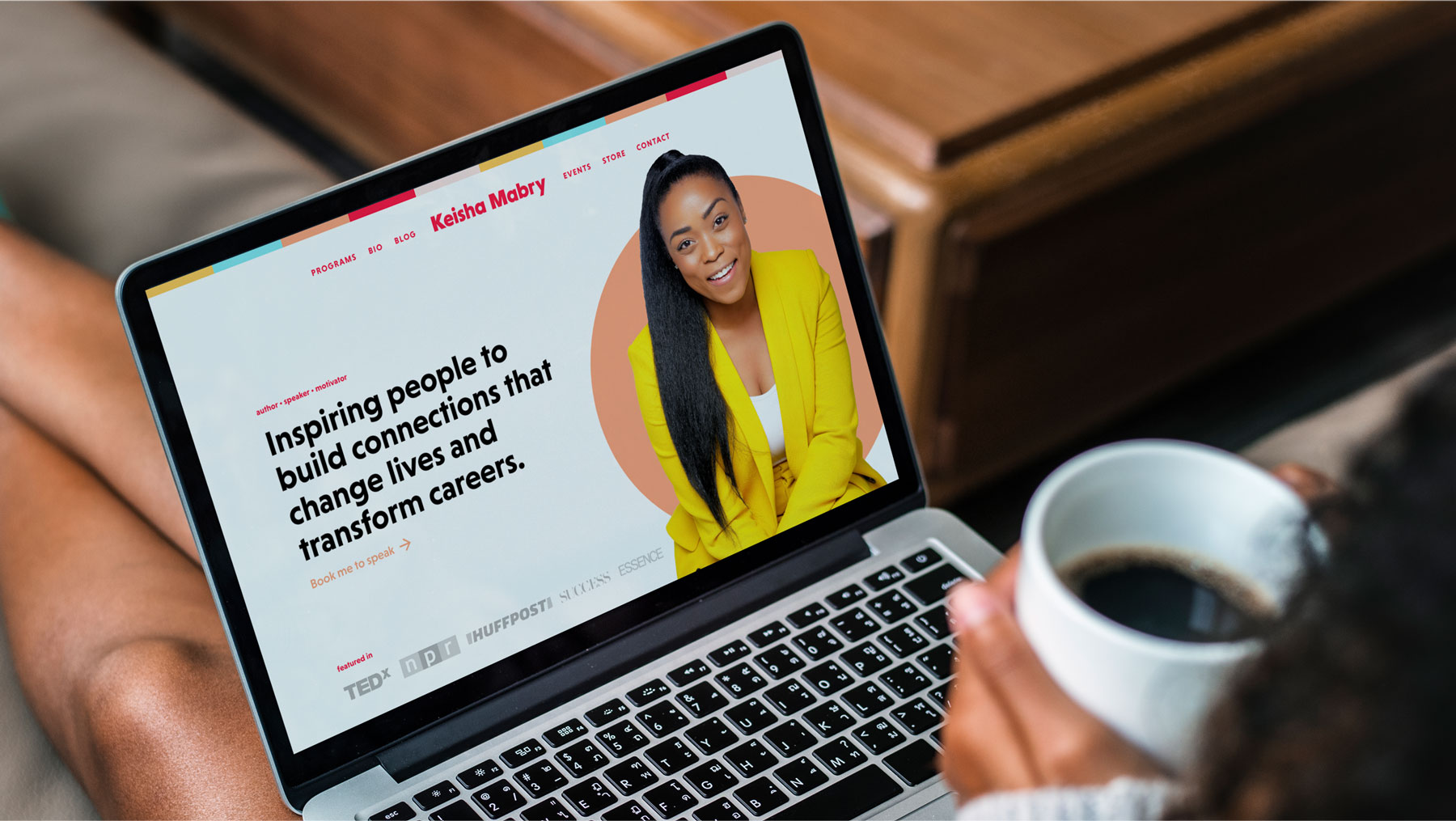 A woman reads Keisha Mabry's website on a laptop