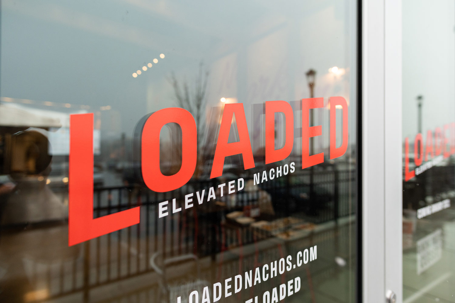 Fast-casual branding on Loaded front door signage