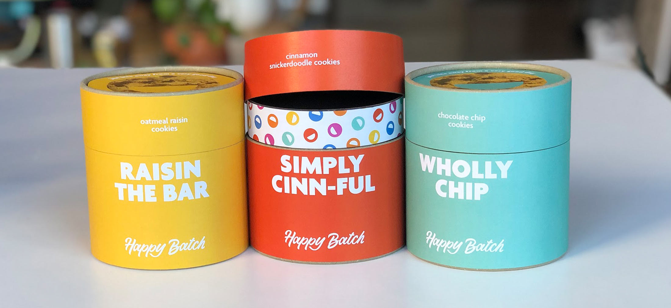 Mockups of early Happy Batch packaging design options