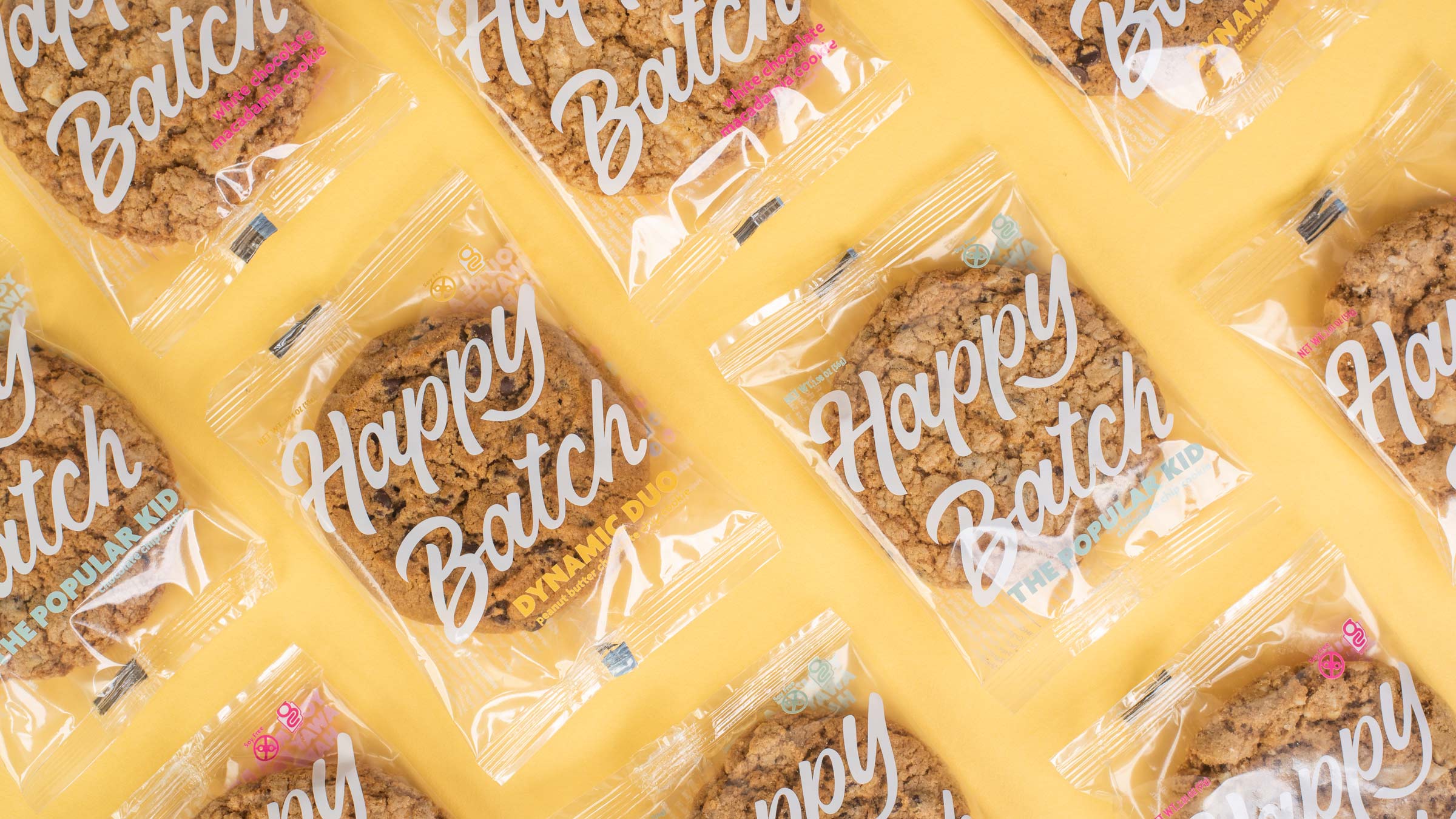 Happy Batch cookies on a yellow background