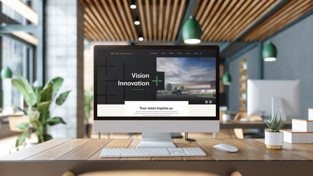 The M+H Architects website on a desktop computer
