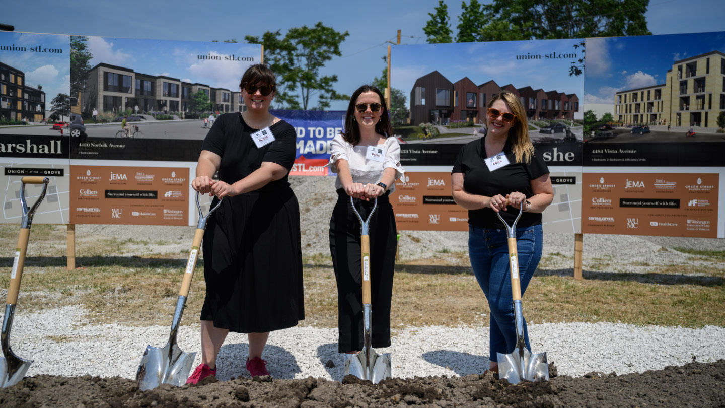 Atomicdust team members stand with shovels at the Terra and Union groundbreaking ceremony