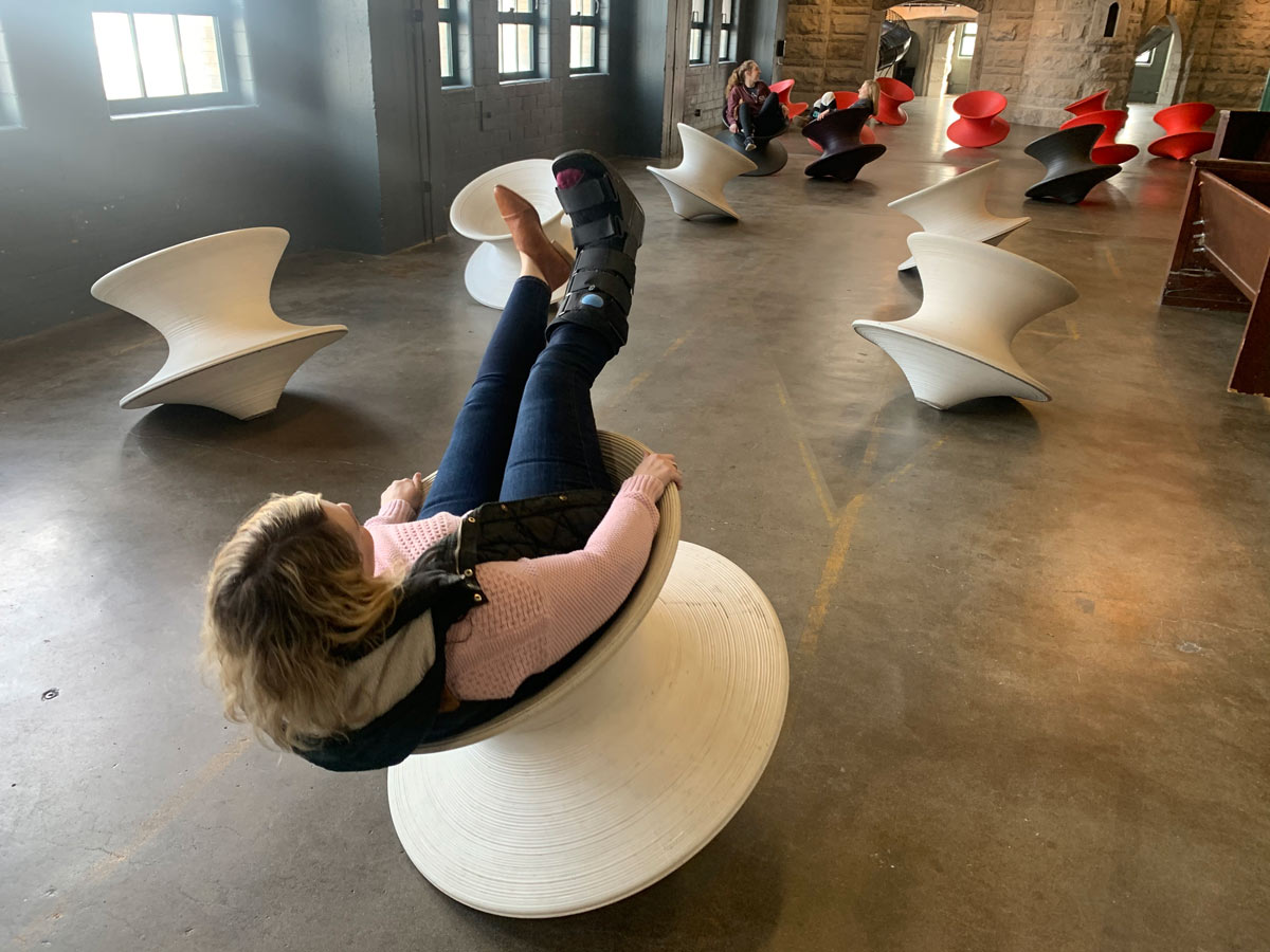 Erika sits on a Spun chair at the City Museum