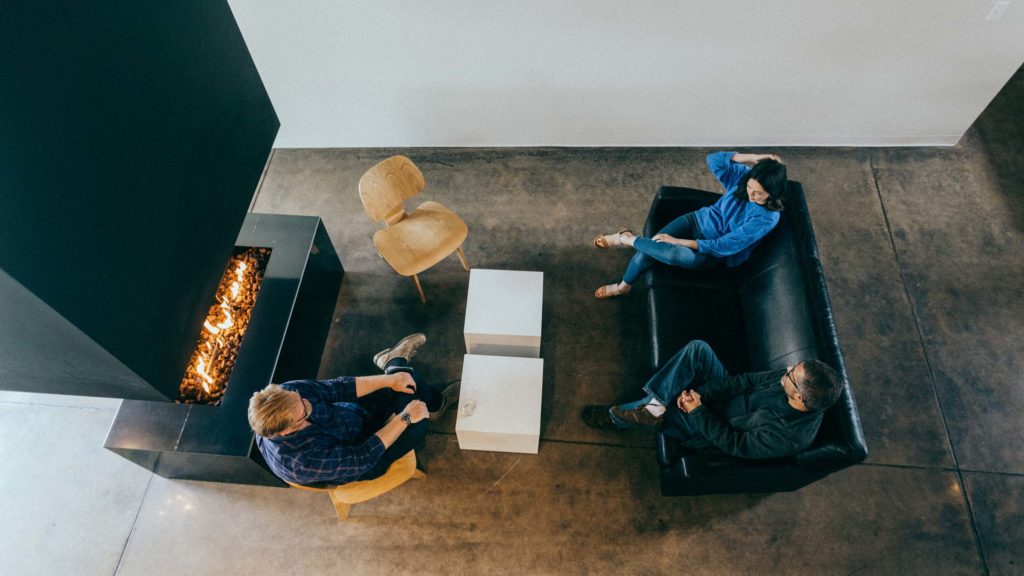 Atomicdust team members discuss a project in the office