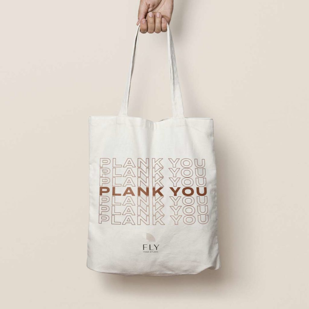 Fly Yoga tote bag that says "Plank You" in the style of a plastic bag with the words "Thank You"