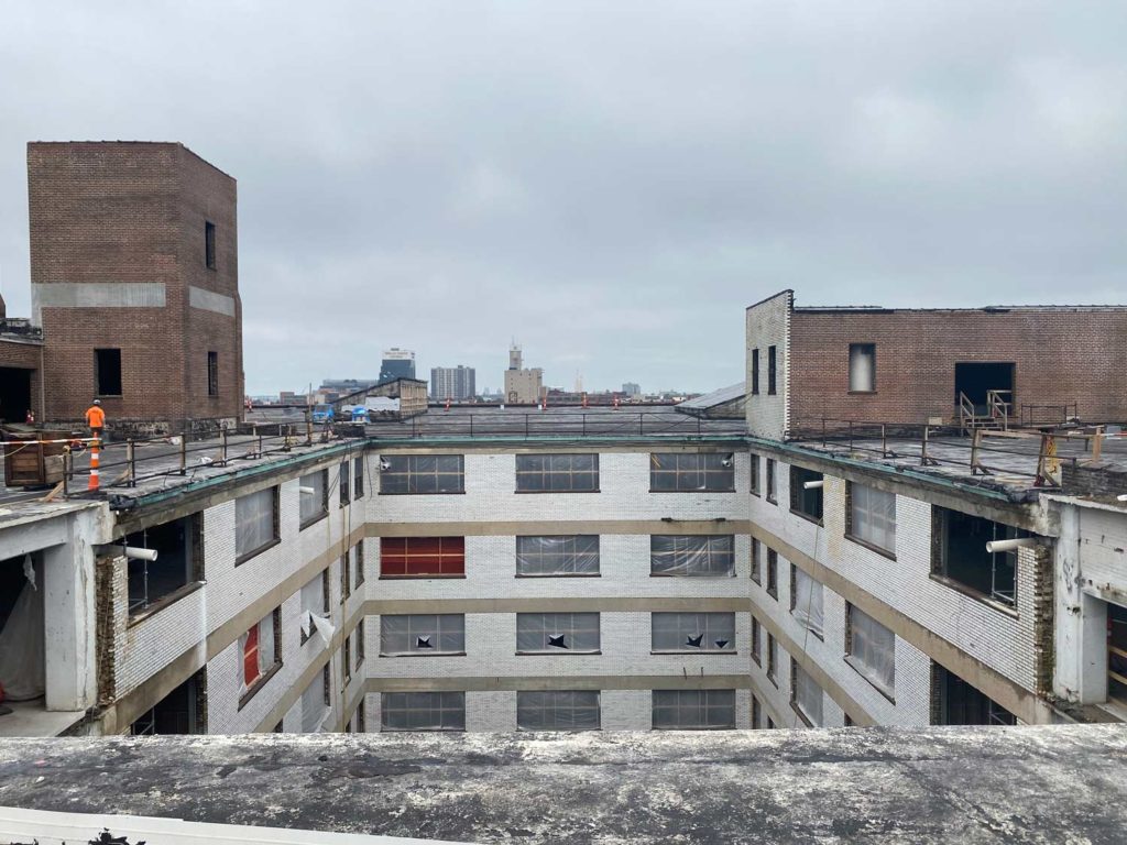 A view into the interior courtyard from the roof of the Butler Brothers Building mid-construction