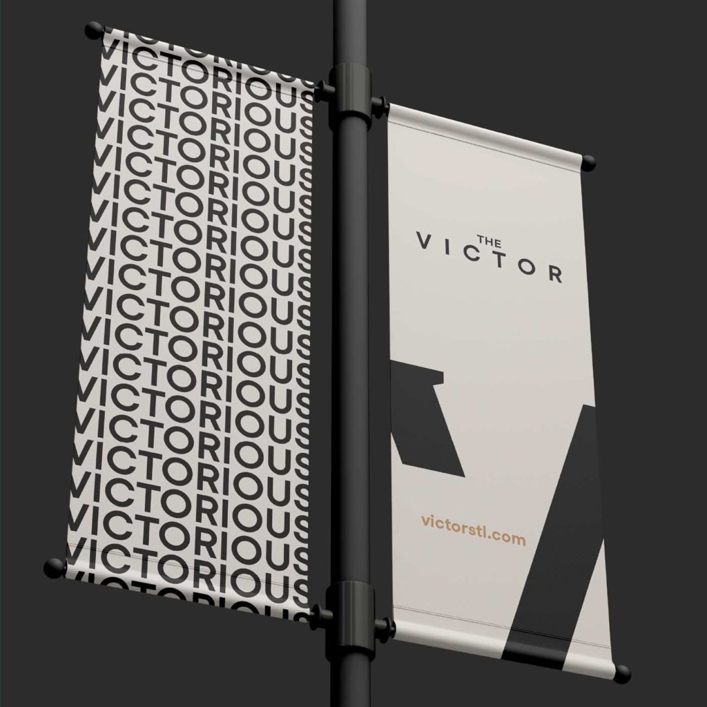 The Victor residential development branding applied to street light banners