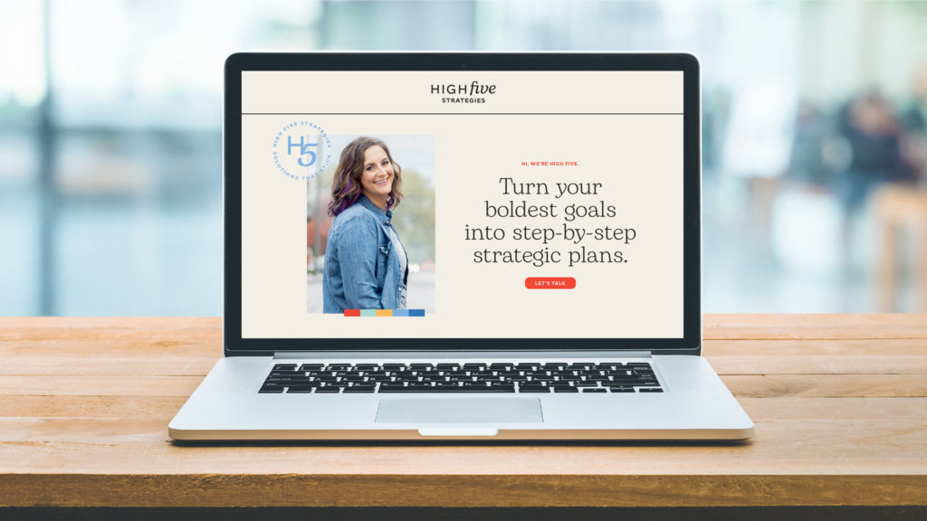 The High Five Strategies website homepage on a laptop