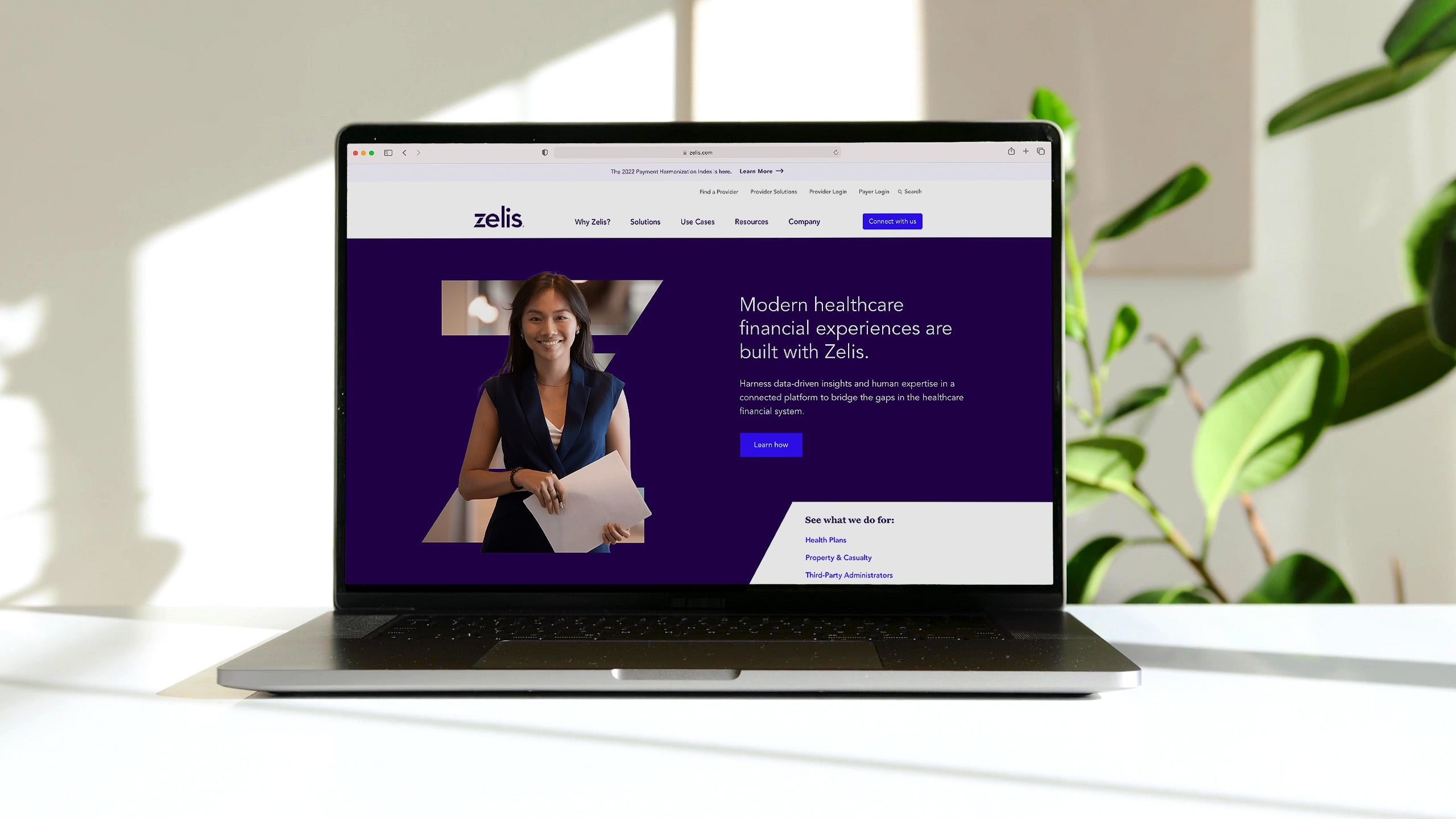 Zelis marketing website on laptop in sun