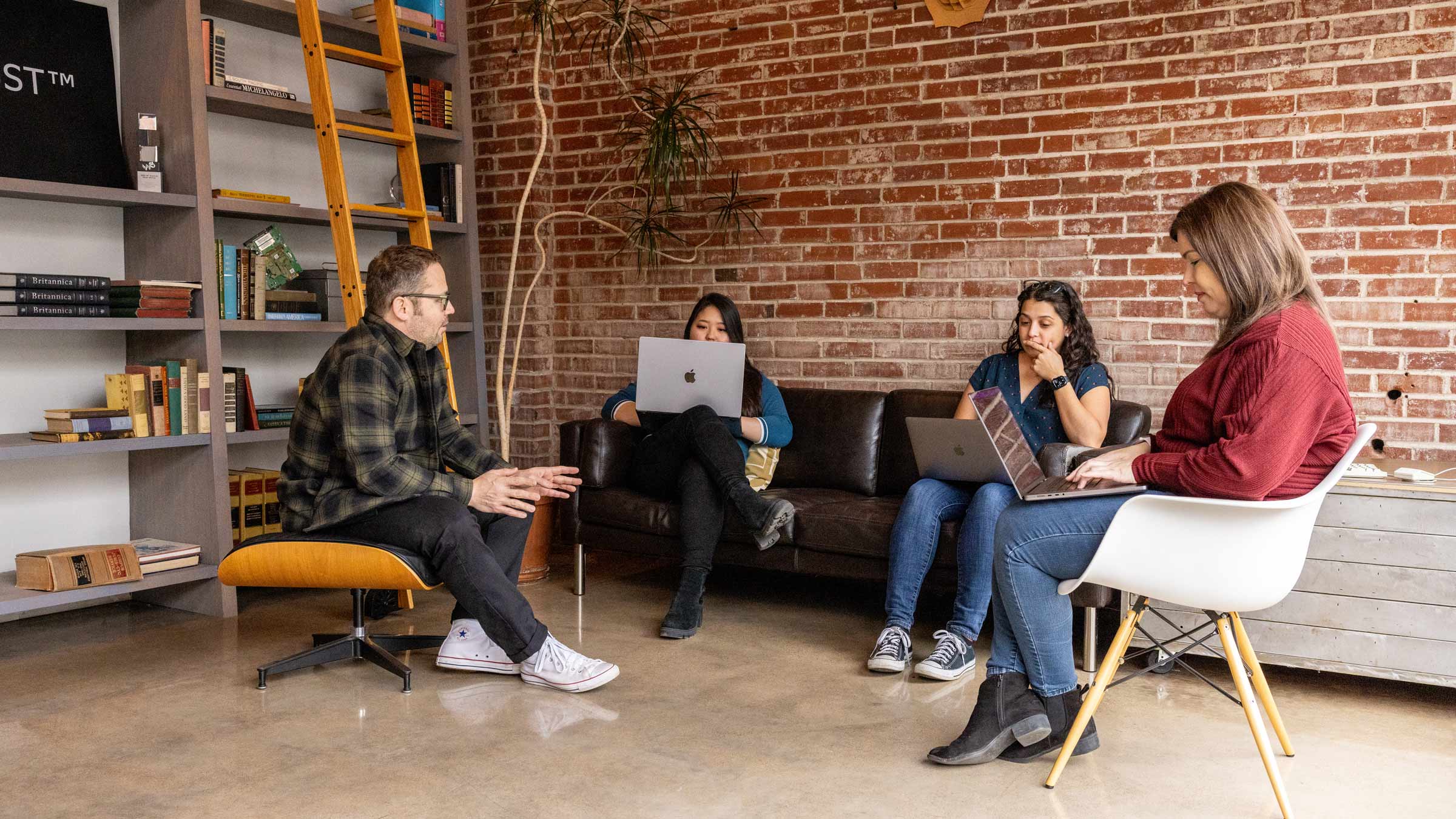 The Atomicdust team works on a project in the office