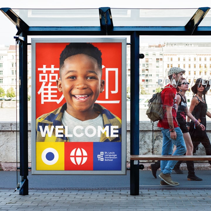 St. Louis Language Immersion School branded bus stop shelter ad