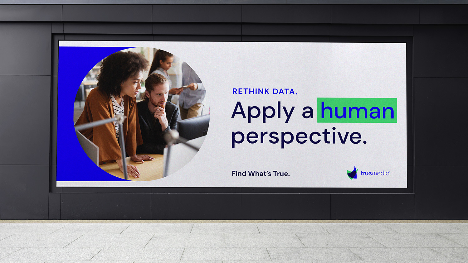 A billboard with True Media's brand and the copy "Rethink data. Apply a human perspective."