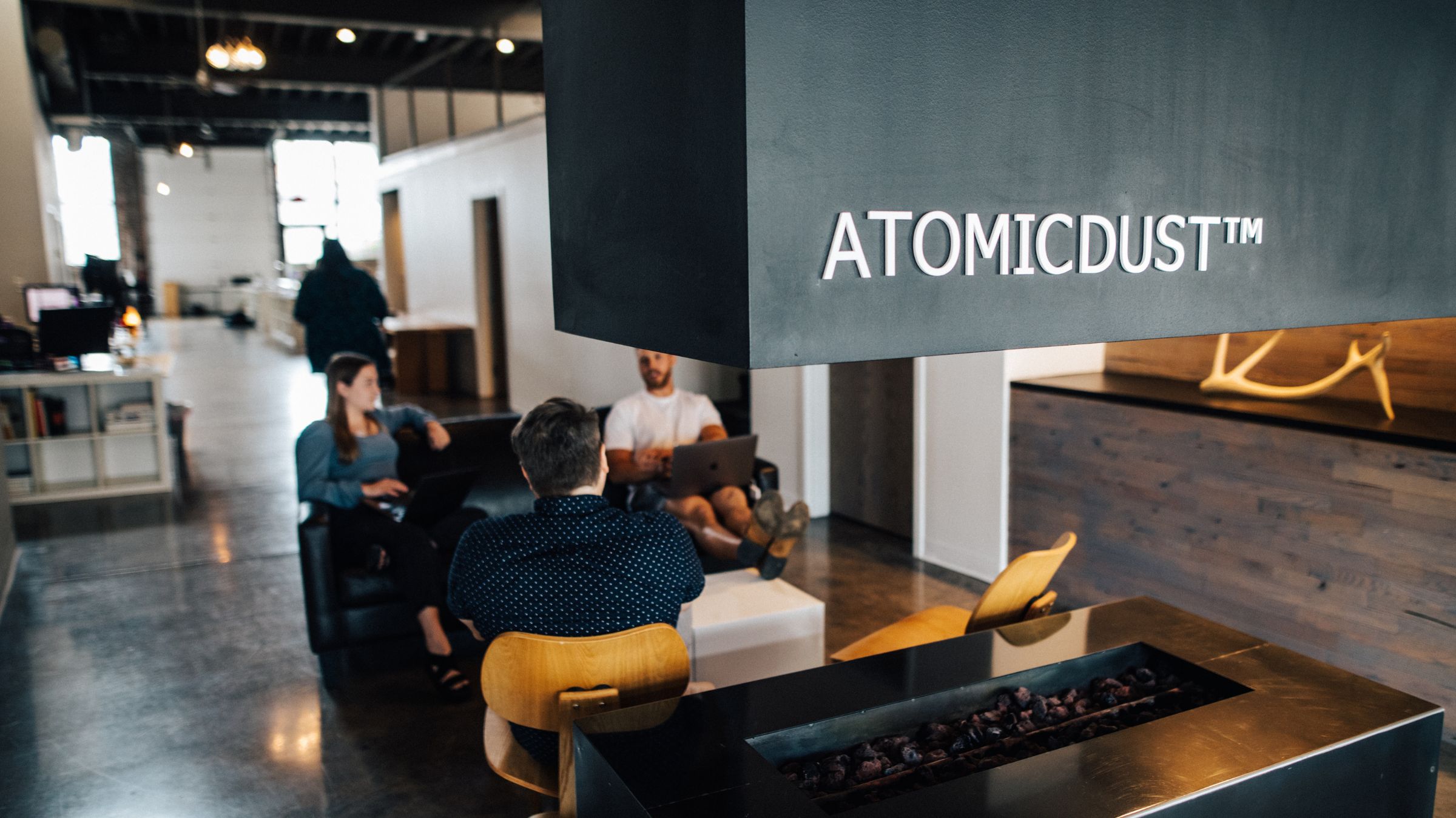 Atomicdust team working in office
