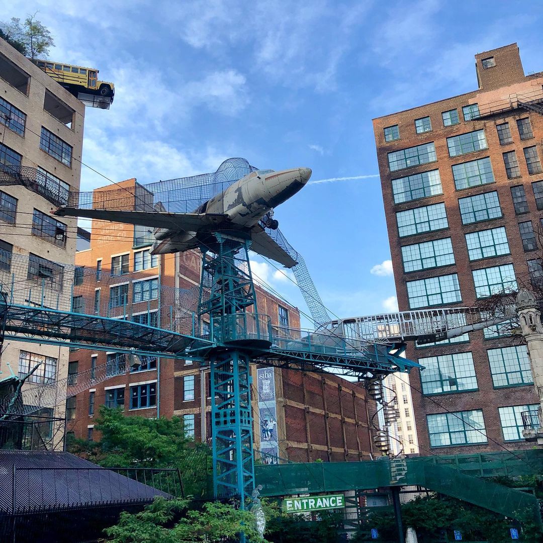Exterior of the City Museum showing the outdoor climbing sculptures and old airplain