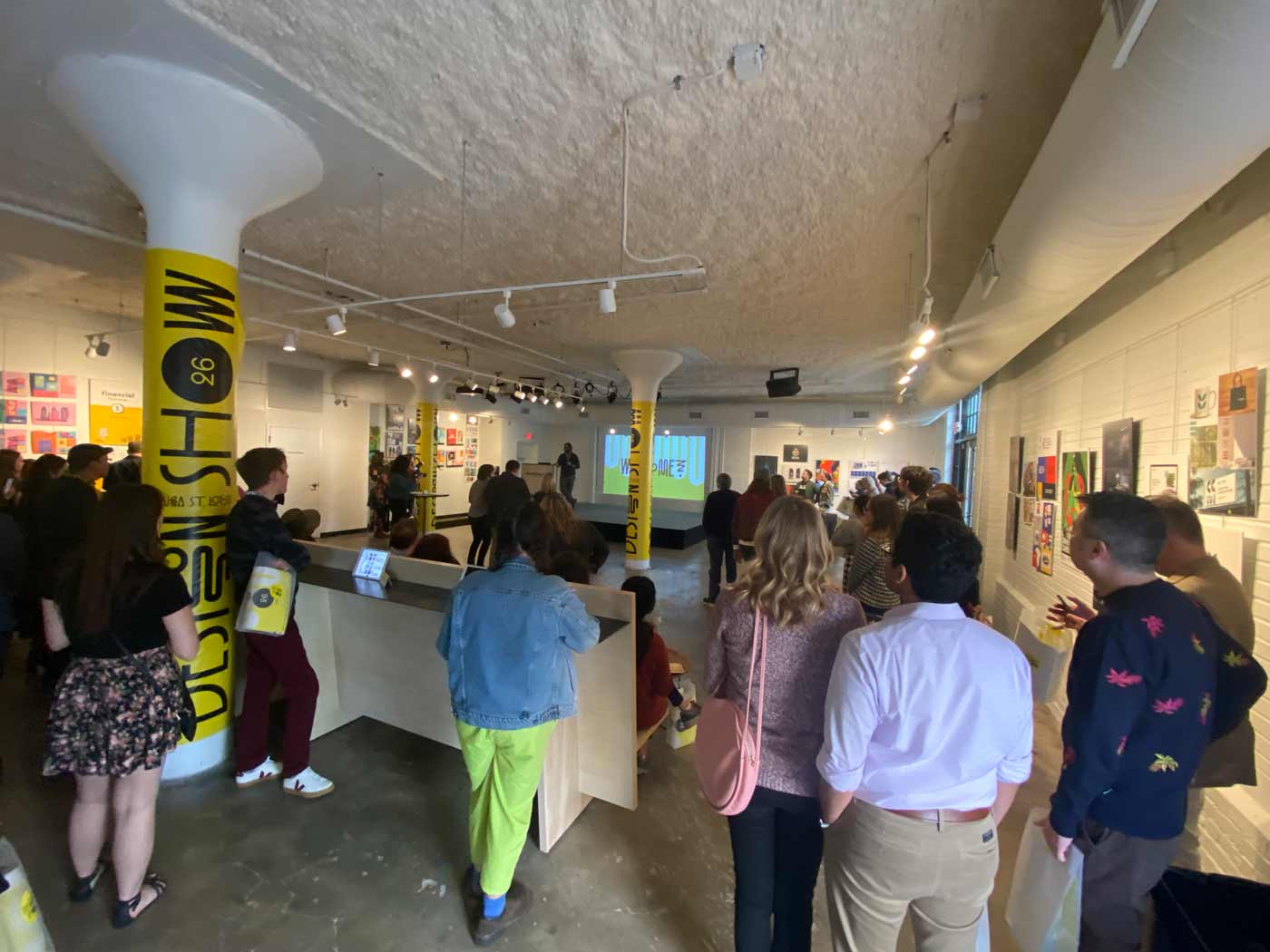 Guests at the AIGA St. Louis Design Show listen to opening remarks