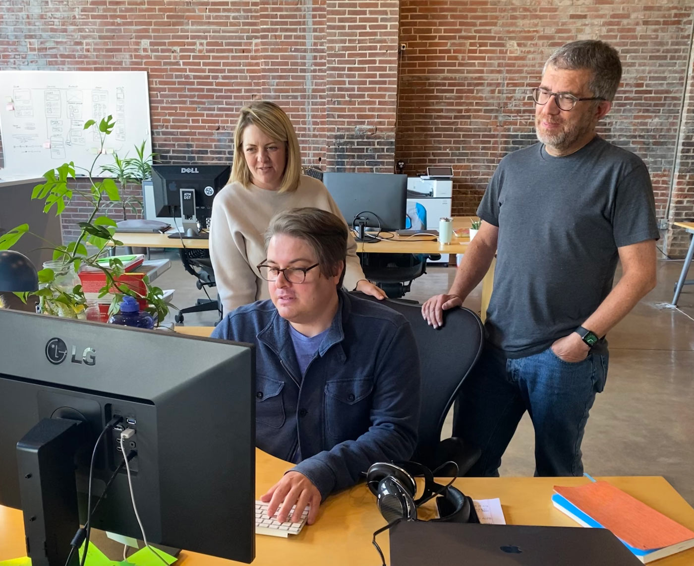 Atomicdust team members working on All Pet Card collateral