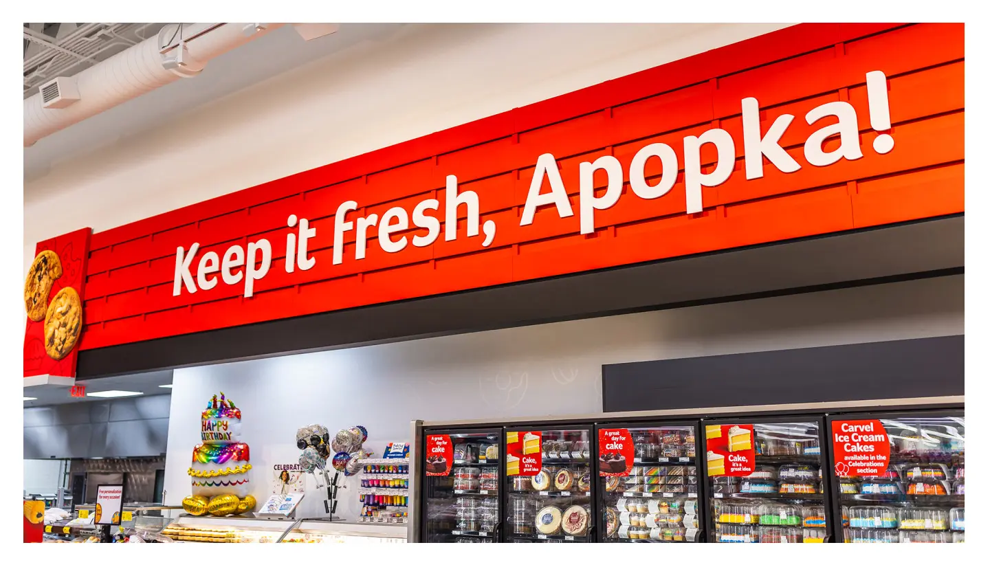 Part of the company's grocery store marketing, store-specific signage and environmental branding in a Winn-Dixie says "Keep it fresh, Apopka!"
