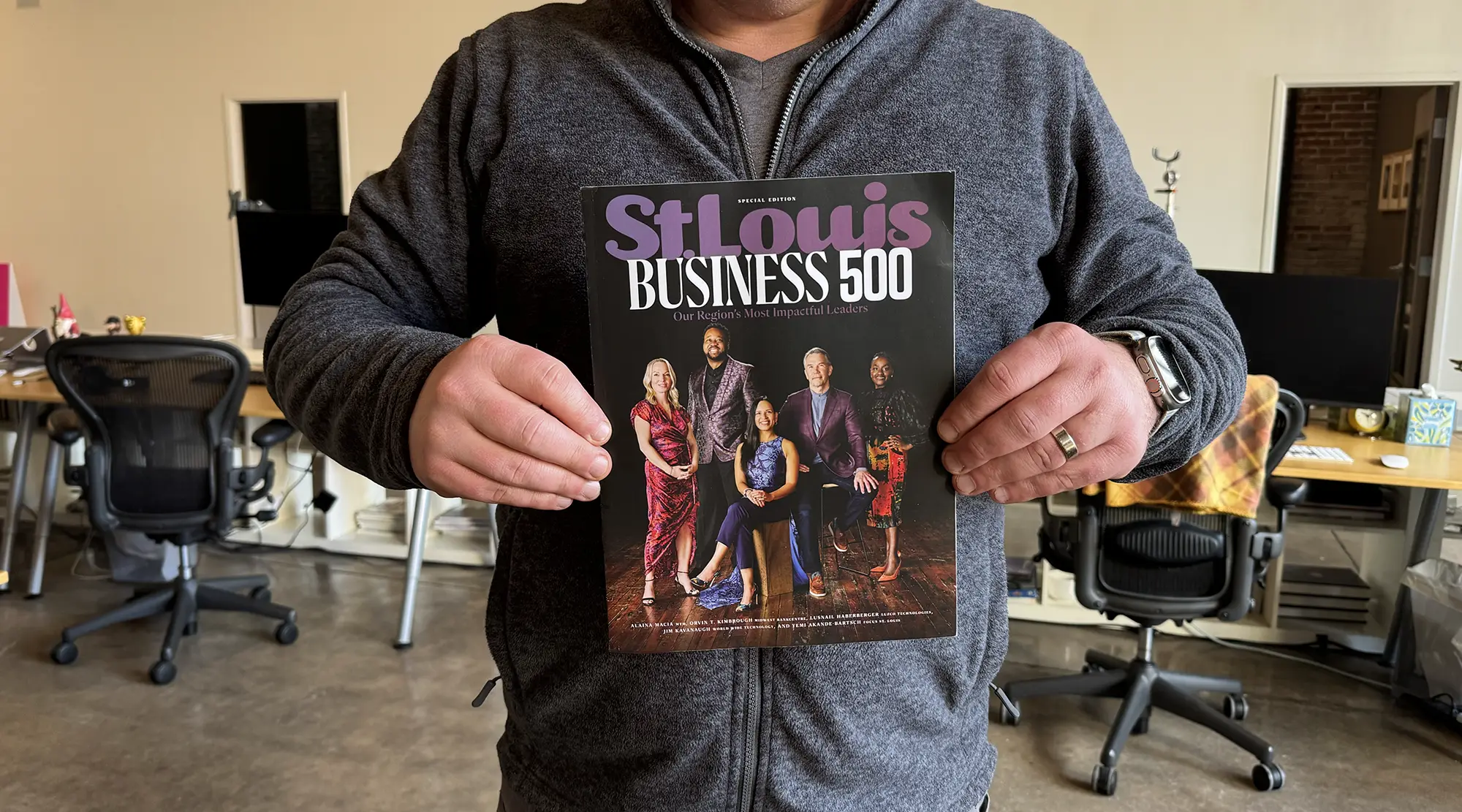 Mikę Spakowski holds St. Louis Magazine's St. Louis Business 500 issue.