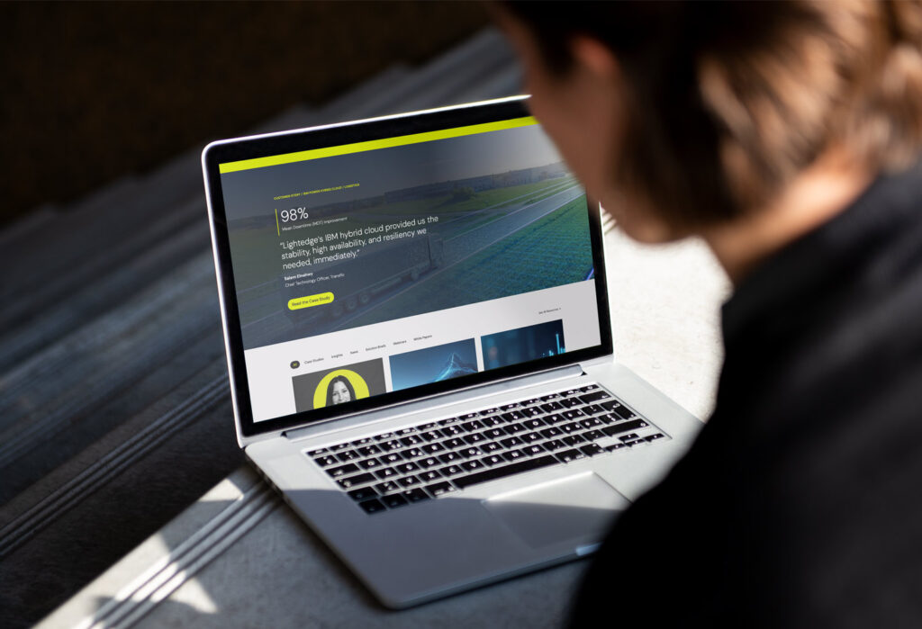 A person looks at the Lightedge website on a laptop